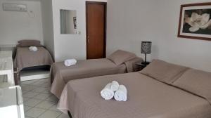 Postel nebo postele na pokoji v ubytování Hotel Nautico