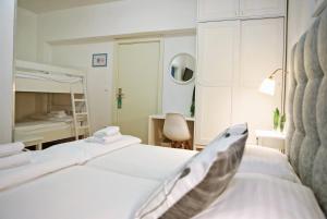 Łóżko lub łóżka w pokoju w obiekcie Hotel Delfin