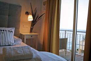 Łóżko lub łóżka w pokoju w obiekcie Hotel Delfin