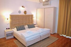 Łóżko lub łóżka w pokoju w obiekcie Hotel Delfin