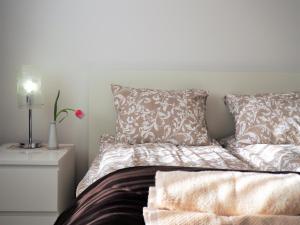 Łóżko lub łóżka w pokoju w obiekcie Apartament 3 pokoje, parking, balkon - Gdańsk Centrum