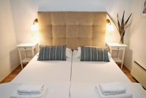 Een bed of bedden in een kamer bij Hotel Delfin