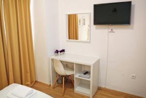 Telewizja i/lub zestaw kina domowego w obiekcie Hotel Delfin