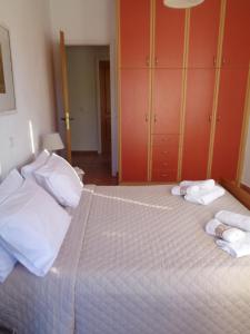 A bed or beds in a room at Melissani House
