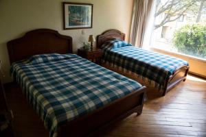 Voodi või voodid majutusasutuse Hostal Bogotá Real toas