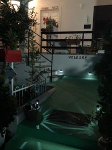 a view of a building with a green courtyard with plants at B&B A casa di Picci in Santa Domenica