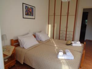 A bed or beds in a room at Melissani House
