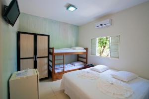 Postel nebo postele na pokoji v ubytování Hotel Pousada Calliandra
