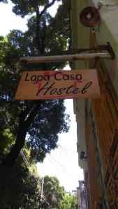 a sign on the side of a building at Lapa Casa Hostel in Rio de Janeiro