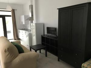 Televízia a/alebo spoločenská miestnosť v ubytovaní Apartamento/Loft en Zona Céntrica I WIFI