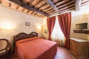 Postel nebo postele na pokoji v ubytování Hotel Cavalieri Del Mare
