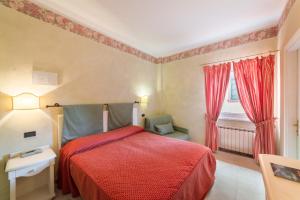 Postel nebo postele na pokoji v ubytování Hotel Cavalieri Del Mare