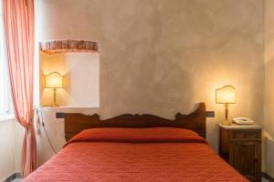 Postel nebo postele na pokoji v ubytování Hotel Cavalieri Del Mare