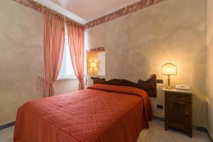 Postel nebo postele na pokoji v ubytování Hotel Cavalieri Del Mare