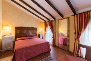 Postel nebo postele na pokoji v ubytování Hotel Cavalieri Del Mare