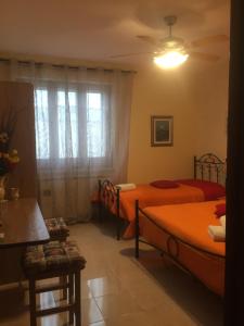 Postel nebo postele na pokoji v ubytování Casa delle Rondini