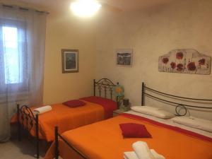 Postel nebo postele na pokoji v ubytování Casa delle Rondini