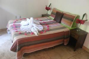 Een bed of bedden in een kamer bij mame trees