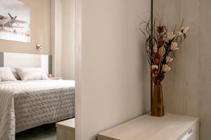 A bed or beds in a room at Alojamiento Turistico La Casa del tio Cesar