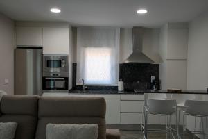 A kitchen or kitchenette at Alojamiento Turistico La Casa del tio Cesar