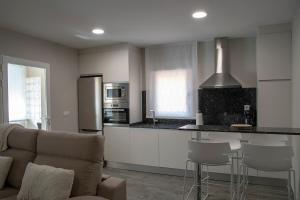 A kitchen or kitchenette at Alojamiento Turistico La Casa del tio Cesar