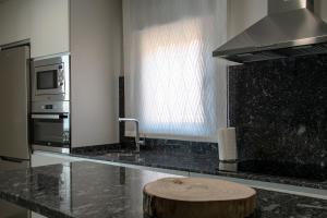 A kitchen or kitchenette at Alojamiento Turistico La Casa del tio Cesar