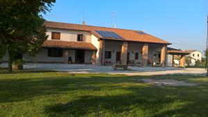 a large building with a grass yard in front of it at Ca'Magnolia in Treviso