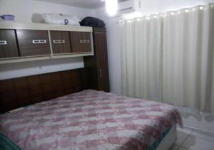 Ένα ή περισσότερα κρεβάτια σε δωμάτιο στο Marina Clube
