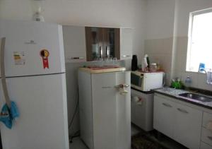 A cozinha ou cozinha compacta de Marina Clube