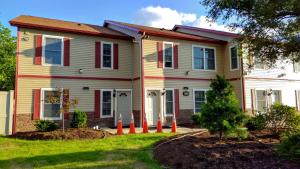 a house with orange cones in front of it at Stay Vacation Homes Niagara Falls in Niagara Falls