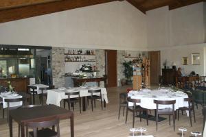 a dining room with white tables and chairs at Agriturismo Cignale della Società Agricola Cignale srl in Penne