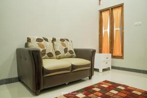 Posezení v ubytování M Stay Guest House Jogja
