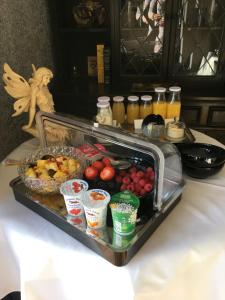 a tray of fruit and drinks on a table at Bonners Lodge in Consett