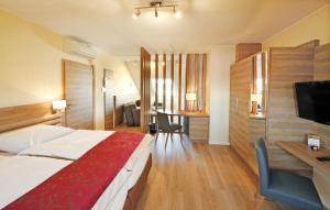 Postel nebo postele na pokoji v ubytování Hotel Saint Fiacre