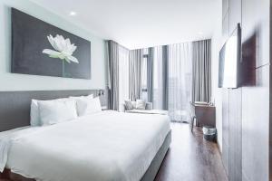 Voodi või voodid majutusasutuse Everland Hotel toas