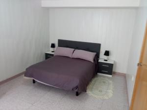 Ένα ή περισσότερα κρεβάτια σε δωμάτιο στο la Casa de Vilanova