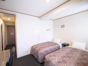 Postel nebo postele na pokoji v ubytování U-Community Hotel + 37 fotografií