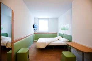 Posteľ alebo postele v izbe v ubytovaní Ibis budget Wien Messe