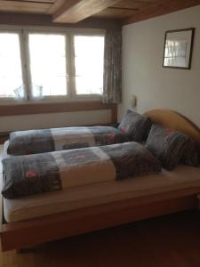 Rúm í herbergi á Café-Conditorei Hotel Huber