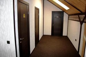 an empty hallway with two elevators and two doors at Villa Venezia in Sevastopol