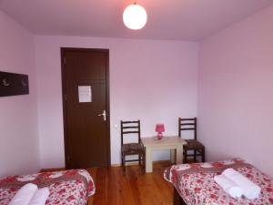 Ένα ή περισσότερα κρεβάτια σε δωμάτιο στο Anano Guest House
