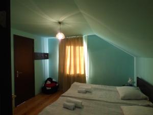 Ένα ή περισσότερα κρεβάτια σε δωμάτιο στο Anano Guest House