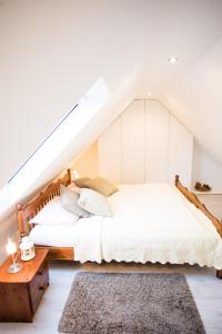 a bedroom with two beds and a table at Ferienwohnungen in Wremen in Wremen