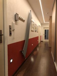 a hallway in a hospital with a hose on the wall at Calm spacy room, own modern bath, near center, to 1 person or a couple - Not suitable for craftsmen, not accepted - privatly rented in Nuremberg