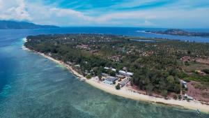 
a beach with a large body of water at Seri Resort Gili Meno in Gili Meno
