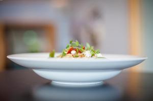 a white bowl of food on a table at Strand Öland in Borgholm