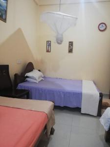 Postel nebo postele na pokoji v ubytování Golden Town Hostel