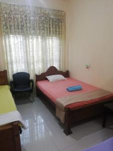 Postel nebo postele na pokoji v ubytování Golden Town Hostel