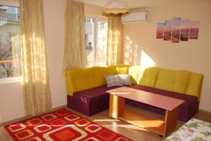 a living room with a couch and a table at CITY STAY in Varna in Varna City