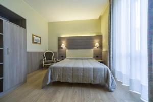 Postel nebo postele na pokoji v ubytování Hotel Est Piombino